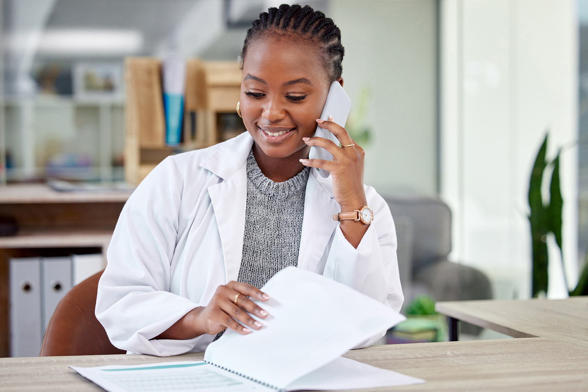 A chiropractor calls her patient's insurance company to confirm coverage